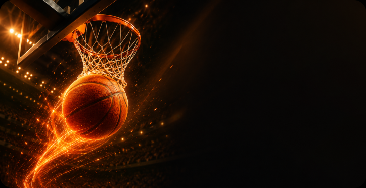Basketball dropping through the hoop with bright orange light trails.
