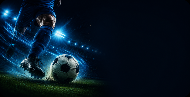 Football player dribbling a ball with blue stadium lights and motion trails.